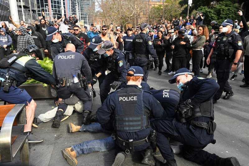 Protesters are arrested by the police at Sydney Town Hall during the ‘World Wide Rally For Freedom’ anti-lockdown rally