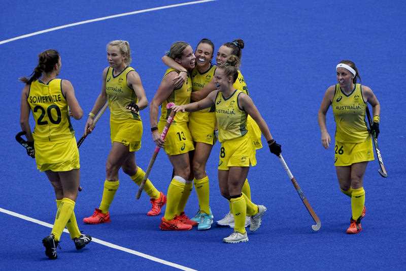 Australia's Hockeyroos celebrate after scoring during a women's field hockey match against Argentina at the Tokyo Olympics