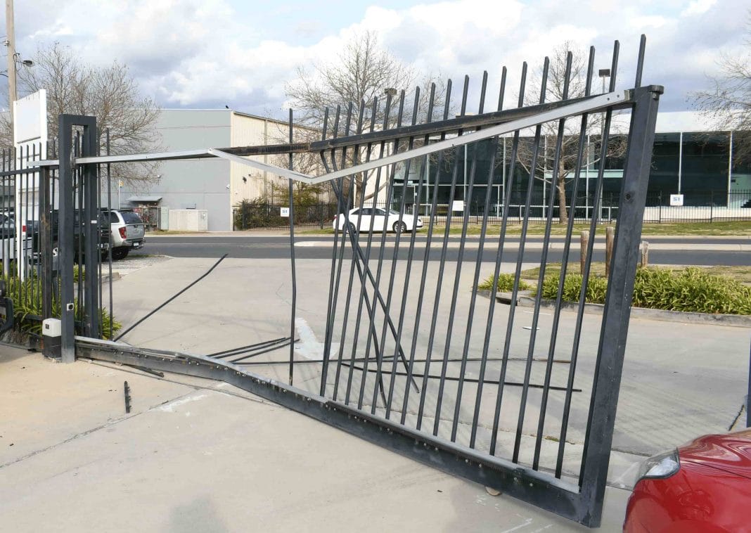 damaged security gates outside Fyshwick caryard