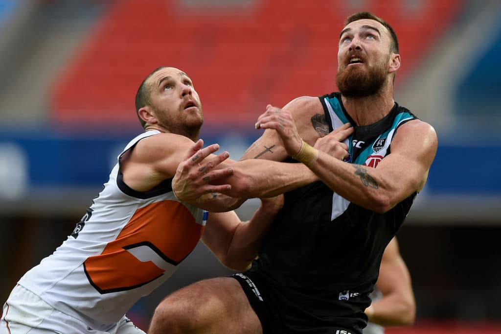 GOLD COAST, AUSTRALIA - JULY 12: Shane Mumford of the Giants competes for the ball against Charlie Dixon of Port Adelaide during the round 6 AFL match between the Port Adelaide Power and the Greater Western Sydney Giants at Metricon Stadium on July 12, 2020 in Gold Coast, Australia. (Photo by Matt Roberts/AFL Photos/via Getty Images)