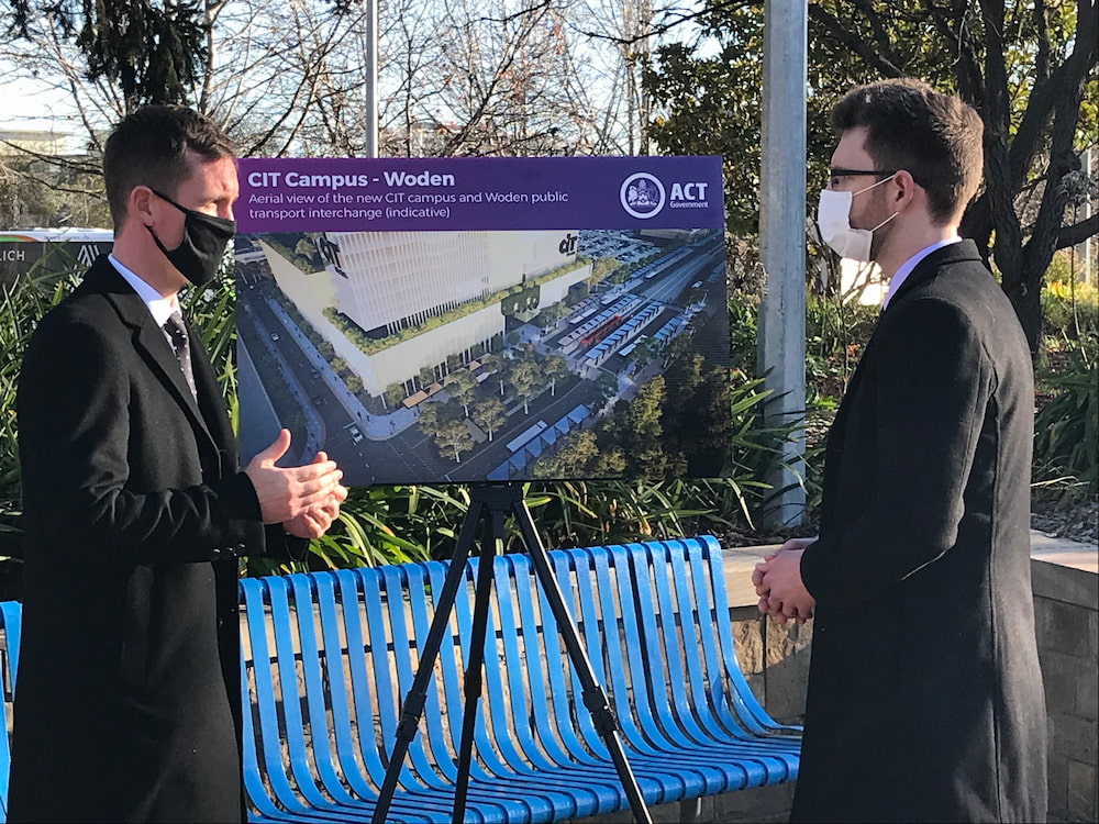 Chris Steel, Minister for Transport and City Services, and Ryan Hemsley, chair of the Public Transport Association of Canberra, discuss the new interchange. Photo: Nick Fuller