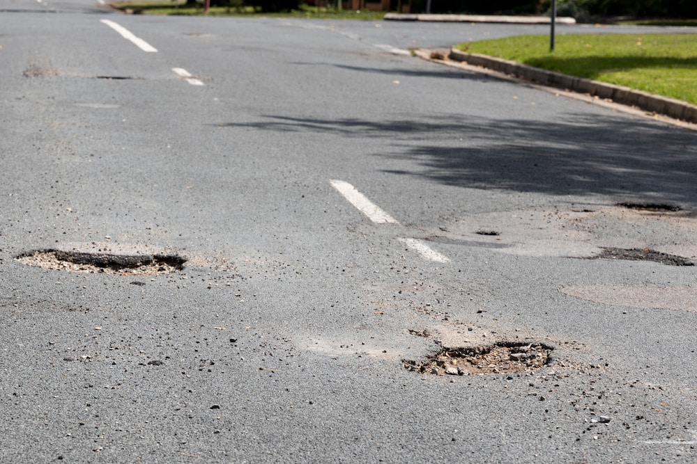 Potholes in a Canberra street. Photo: Kerrie Brewer