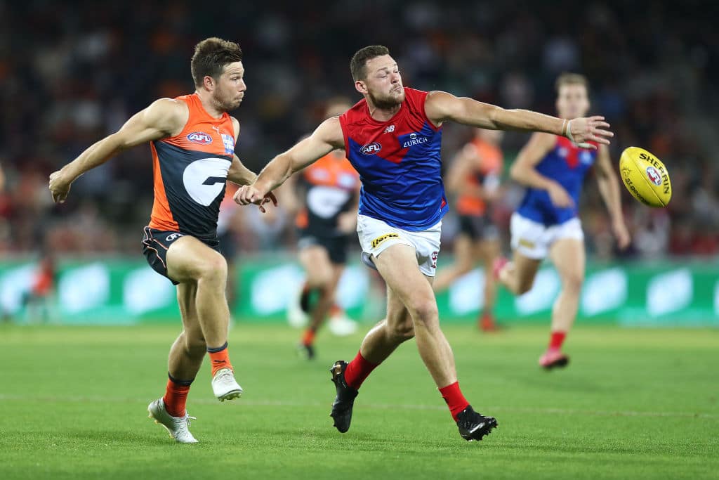 CANBERRA, AUSTRALIA - APRIL 04: Toby Greene of the Giants and Steven May of the Demons compete for the ball during the round 3 AFL match between the GWS Giants and the Melbourne Demons at Manuka Oval on April 04, 2021 in Canberra, Australia. (Photo by Mark Metcalfe/AFL Photos via Getty Images)