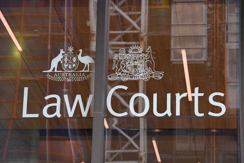 Exterior view of a Law Courts building with the Australian Coat of Arms on the window