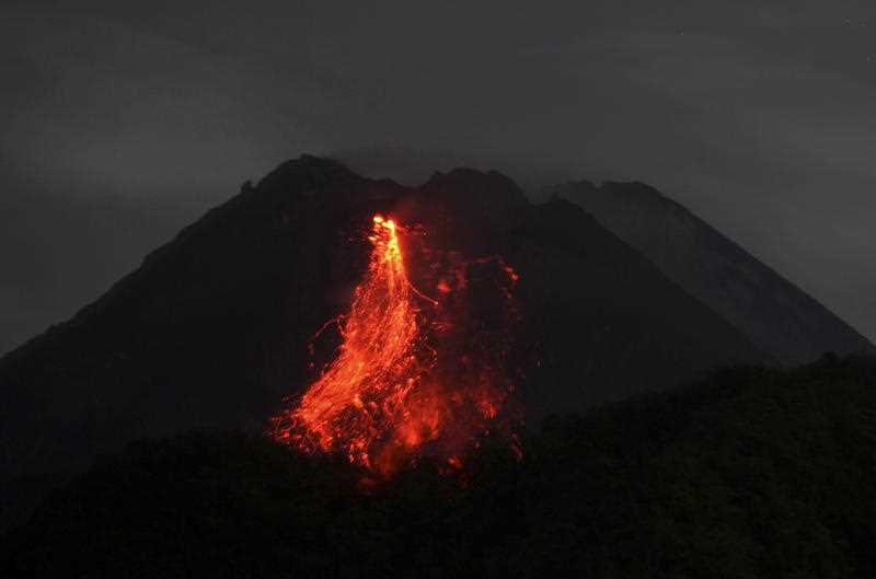 Mount Merapi volcano spews lava during an eruption, as seen from Sleman, Yogyakarta, Indonesia
