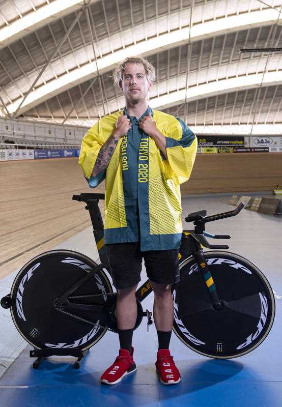 Australian track cyclist Sam Welsford poses with his Tokyo Kimono and track bicycle during an Australian Olympic Cycling Team media event, at the Adelaide SuperDrome in May