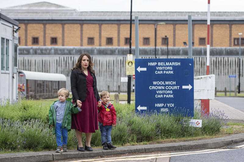 Stella Moris stands with her children Gabriel, four, left, and Max, two, outside Belmarsh Prison, following a visit to her partner and their father Julian Assange in London, Saturday June 19, 2021