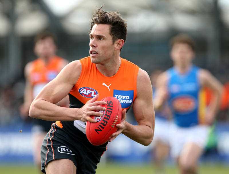 Josh Kelly of the Giants takes possession of the ball during an AFL match