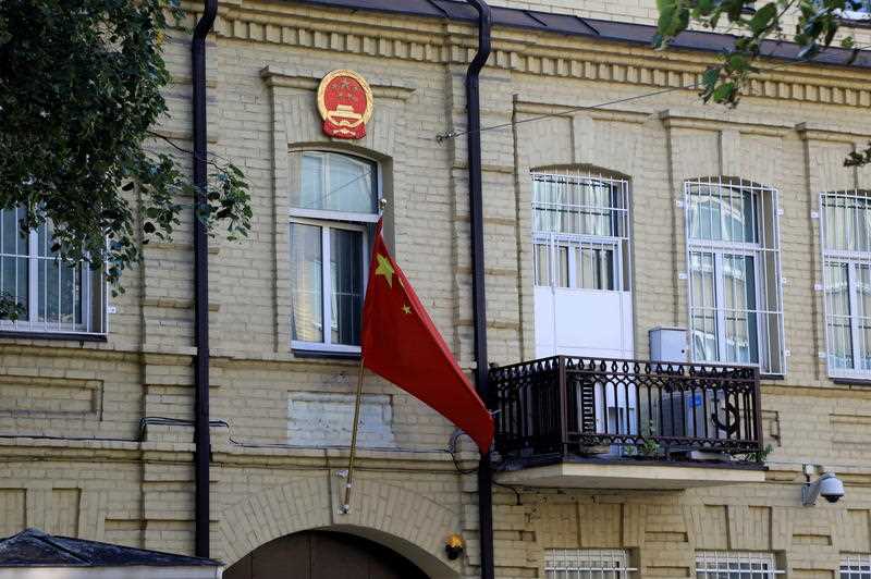The national flag hangs on the facade of the Chinese Embassy building in Vilnius, Lithuania