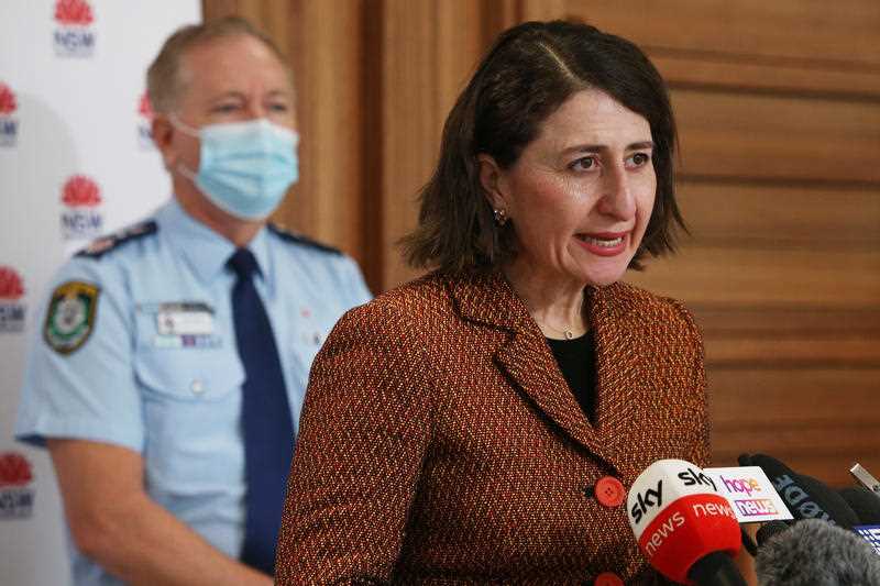 NSW Premier Gladys Berejiklian speaks to the media with NSW Police Commissioner Mick Fuller during a press conference in Sydney