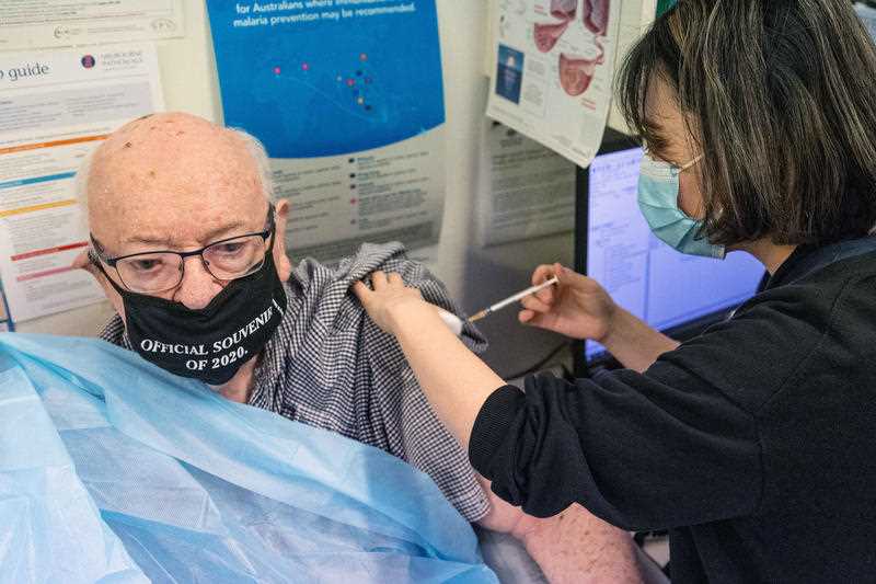 An elderly man receives his second COVID-19 vaccination in Melbourne