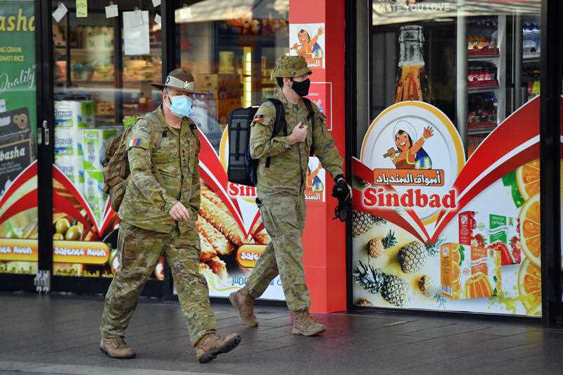 Australian Defence Force personnel are seen patrolling the streets at Fairfield in the south west suburb of Sydney