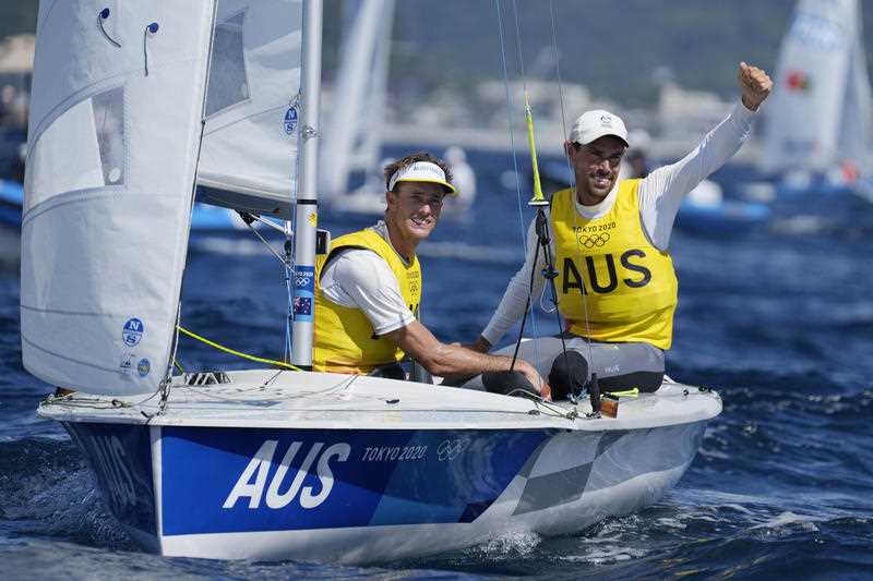 Australia's Will Ryan and Mathew Belcher celebrate at the end of a men's 470 class race at the 2020 Summer Olympics