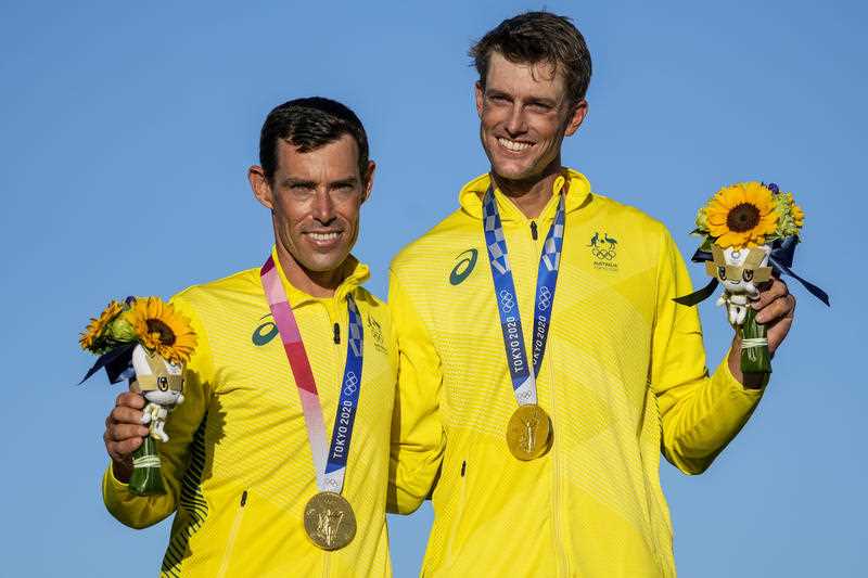 Australia's Will Ryan and Mathew Belcher celebrate the 470 men's gold medal during the 2020 Summer Olympics
