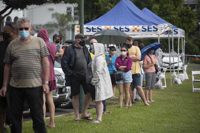 Cairns residents queue for Covid-19 tests at a testing centre on the Cairns Esplanade
