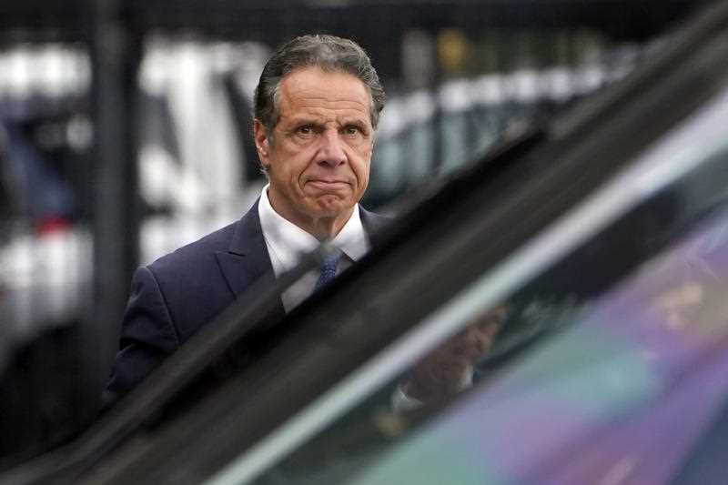 New York Governor Andrew Cuomo prepares to board a helicopter after announcing his resignation in New York. Sexual harassment allegations cost Cuomo his job.