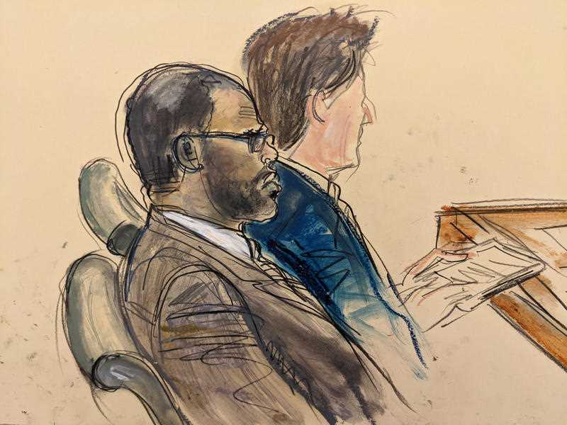 In this courtroom artist's sketch made from a video screen monitor of a Brooklyn courtroom, defendant R. Kelly, left, listens during the opening day of his trial, Wednesday, Aug. 18, 2021 in New York