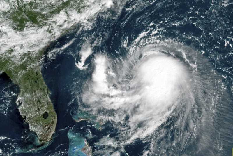 A satellite image shows Tropical Storm Henri in the Atlantic Ocean. Henri was expected to intensify into a hurricane