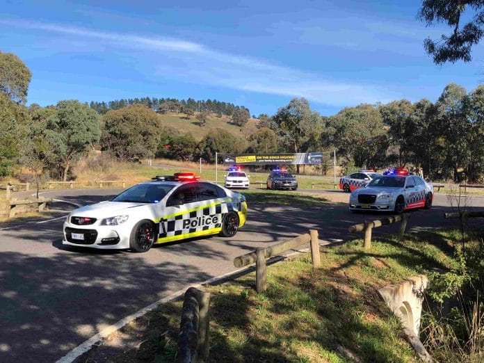 several NSW and ACT police cars on the Kings Highway east of Queanbeyan