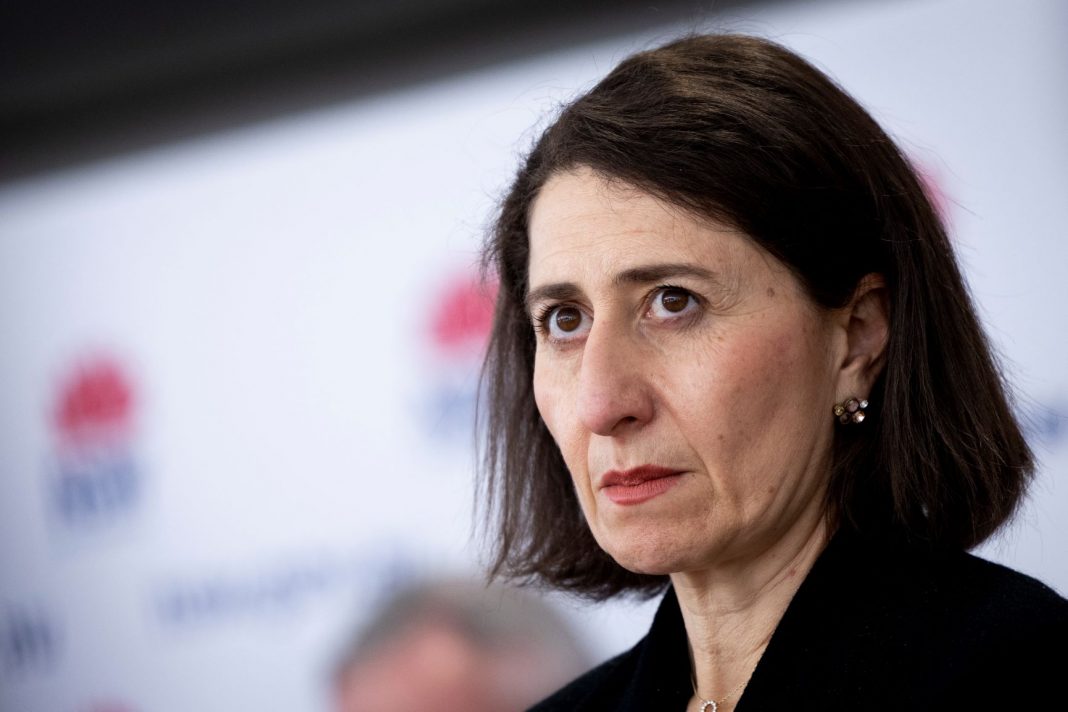 NSW Premier Gladys Berejiklian looking sombre at a press conference on COVID cases in NSW