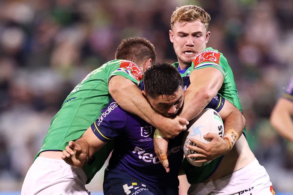 CANBERRA, AUSTRALIA - MAY 22: Brandon Smith of the Storm is tackled during the round 11 NRL match between the Canberra Raiders and the Melbourne Storm at GIO Stadium, on May 22, 2021, in Canberra, Australia. (Photo by Mark Kolbe/Getty Images)