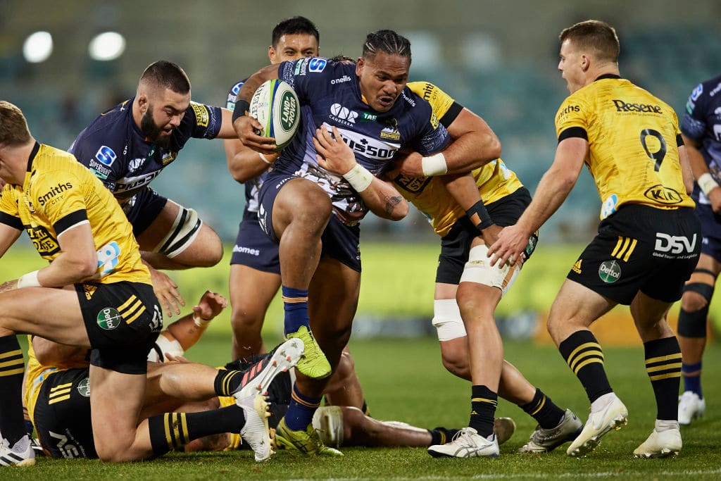 CANBERRA, AUSTRALIA - JUNE 05: Solomone Kata of the Brumbies is tackled during the round four Super Rugby Trans-Tasman match between the ACT Brumbies and the Hurricanes at GIO Stadium on June 05, 2021 in Canberra, Australia. (Photo by Brett Hemmings/Getty Images)