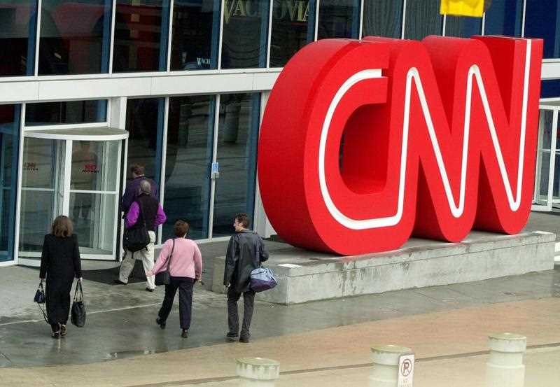 people are seen entering CNN Center, the headquarters for CNN, in downtown Atlanta