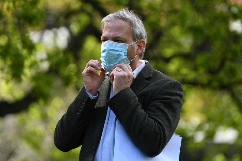 Victorian Chief Health Officer Brett Sutton adjusts his face mask during a press conference in Melbourn