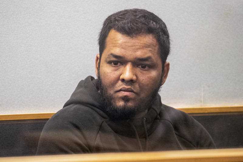 Ahmed Aathill Mohamed Samsudeen appears in the High Court in Auckland, New Zealand, Aug. 7, 2018, after he was found possessing a series of images which depict extreme violence, cruelty, death and graphic war scenes.