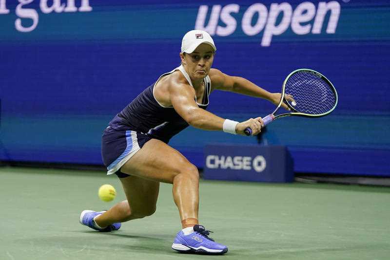 Ashleigh Barty, of Australia, returns a shot to Shelby Rogers, of the United States, during the third round of the US Open tennis championships, Saturday, Sept. 4, 2021, in New York.
