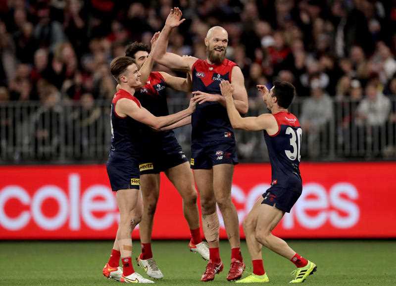 Max Gawn of the Demons is congratulated by teammates after kicking a goal during the AFL Preliminary Final match between the Melbourne Demons and Geelong Cats at Optus Stadium, Perth, Friday, September 10, 2021.