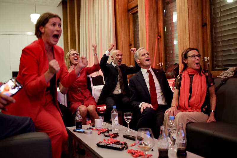 Labor leader Jonas Gahr Store cheers after seeing the exit poll during the Labor Party's election party at Folkets hus in the 2021 Norwegian parliamentary elections, in Oslo, Monday, Sept. 13, 202