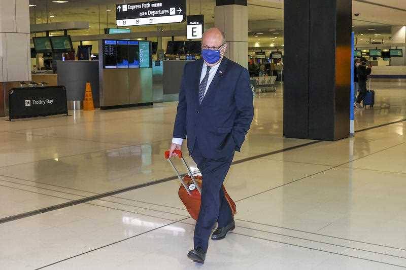 France's Ambassador to Australia Jean-Pierre Thebault arrives at Sydney Airport, Saturday, Sept. 18, 2021.