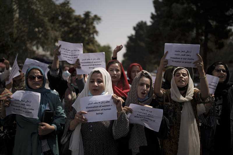 Afghan women march to demand their rights under the Taliban rule during a demonstration near the former Women's Affairs Ministry building in Kabul, Afghanistan, Sunday, Sept. 19, 2021