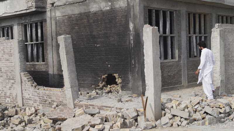A man surveys the site of the blast targeting the government girls school in Tank, South Waziristan tribal region, Pakistan, 22 September 2021