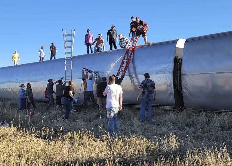 people work at the scene of an Amtrak train derailment on Saturday, Sept. 25, 2021, in north-central Montana