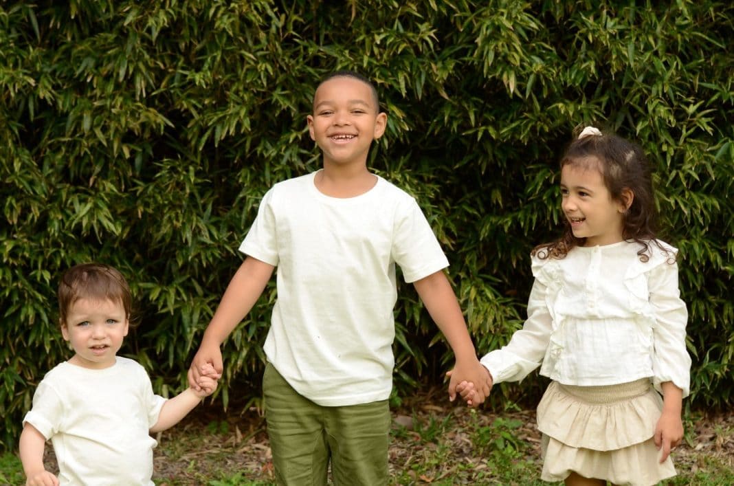 Supplied PR image of three young children wearing white shirts for Bravehearts' White Balloon Day