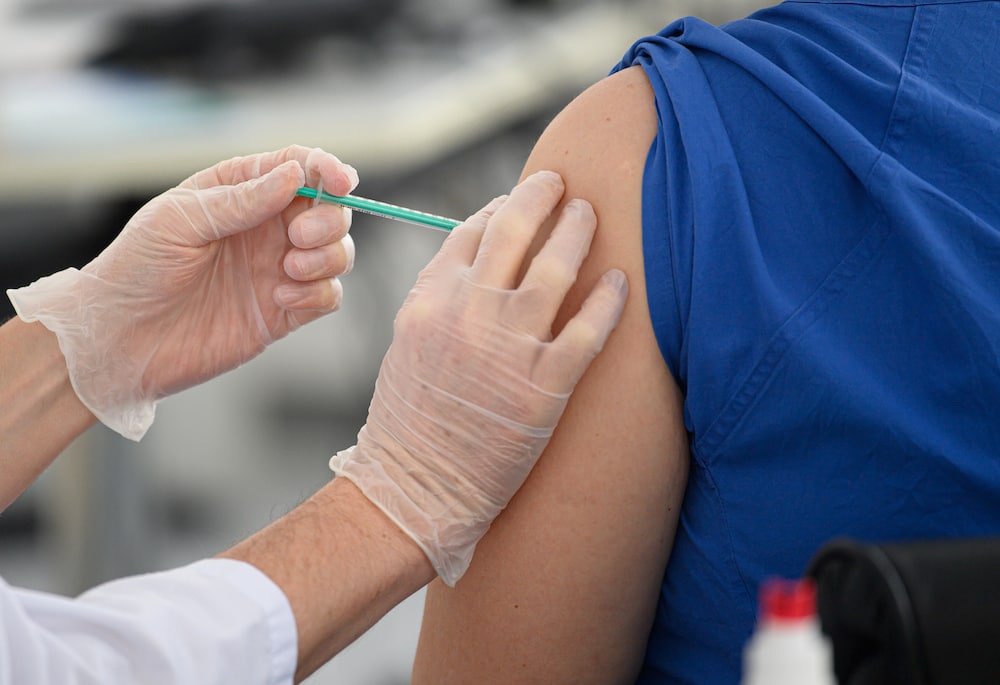 ACT COVID-19 vaccination jab in arm