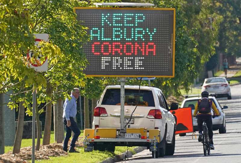 An electronic sign displaying information regarding the Coronavirus disease (COVID-19) is seen near a Melbourne Storm NRL training session at Albury Sports Ground in Albury, Wednesday, May 6, 2020.