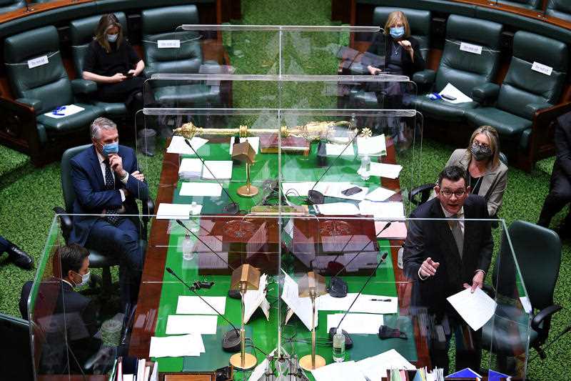 Victorian Premier Daniel Andrews (right) speaks during question time in the Legislative Assembly at the Parliament of Victoria in Melbourne, Tuesday, September 7, 2021