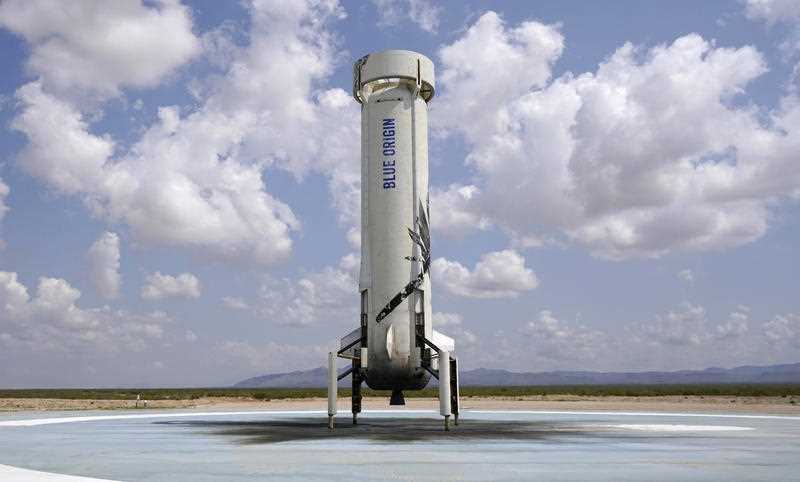 Blue Origin's New Shepard rocket sits on the landing pad after carrying passengers Jeff Bezos, founder of Amazon and space tourism company Blue Origin, brother Mark Bezos, Oliver Daemen and Wally Funk, from its spaceport near Van Horn, Texas on July 20, 2021