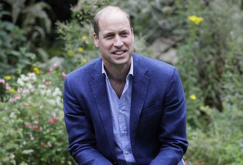 Britain's Prince William speaks with service users during a visit to the Garden House in Peterborough, England.