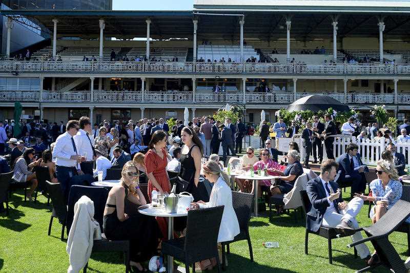 Racegoers are seen during The Everest raceday at Royal Randwick Racecourse in Sydney, Saturday, October 16, 2021.