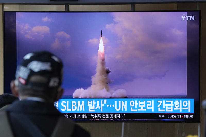 A man watches a TV screen showing an image of North Korea's ballistic missile launched from a submarine during a news program at Seoul Railway Station in Seoul, South Korea, Wednesday, Oct. 20, 2021.