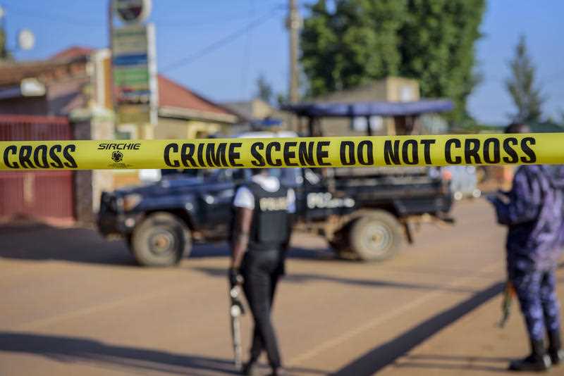 Police secure a road leading to the scene of an explosion in the Komamboga suburb of the capital Kampala, Uganda Sunday, Oct. 24, 2021.