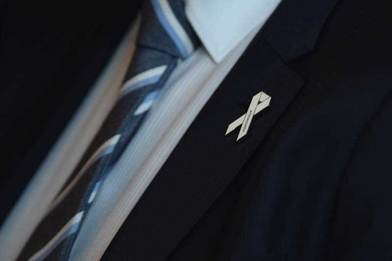 Australia's then Opposition Leader Bill Shorten wears a White Ribbon pin as he attends the White Ribbon day breakfast event at Parliament House in Canberra, Wednesday, Nov. 23, 2016.