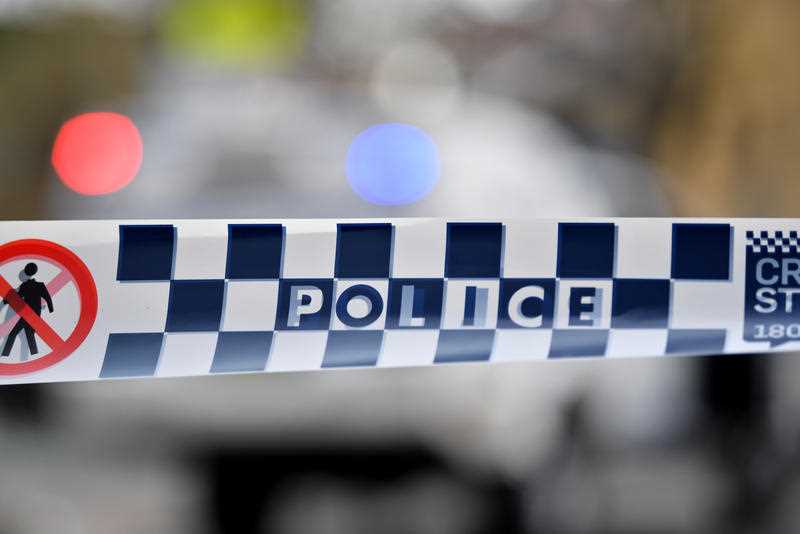 NSW Police tape restricts access to a street