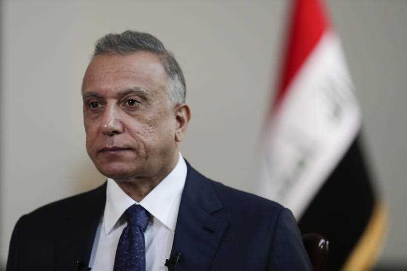 Iraqi Prime Minister Mustafa al-Kadhimi poses in his office during an interview with The Associated Press in Baghdad, Iraq, Friday, July 23, 2021.
