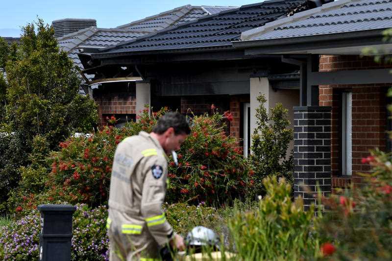 Emergency services at the scene of a house fire at Werribee in Melbourne, Sunday, November 21, 2021, in which four children under 10 years old died