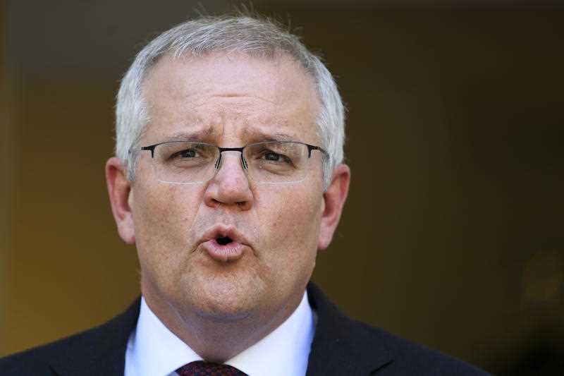 Australian Prime Minister Scott Morrison speaks during a press conference at Parliament House in Canberra, Tuesday, November 30, 2021.
